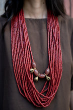 Load image into Gallery viewer, Goulu statement beaded necklace in beads and brass bell