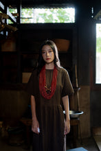 Load image into Gallery viewer, Goulu statement beaded necklace in beads and brass bell