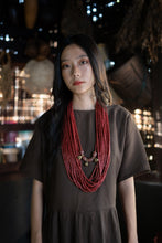 Load image into Gallery viewer, Goulu statement beaded necklace in beads and brass bell
