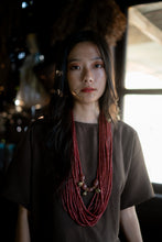 Load image into Gallery viewer, Goulu statement beaded necklace in beads and brass bell
