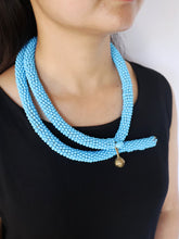 Load image into Gallery viewer, Goulu Statement Necklace Blue Beads With Brass Bell
